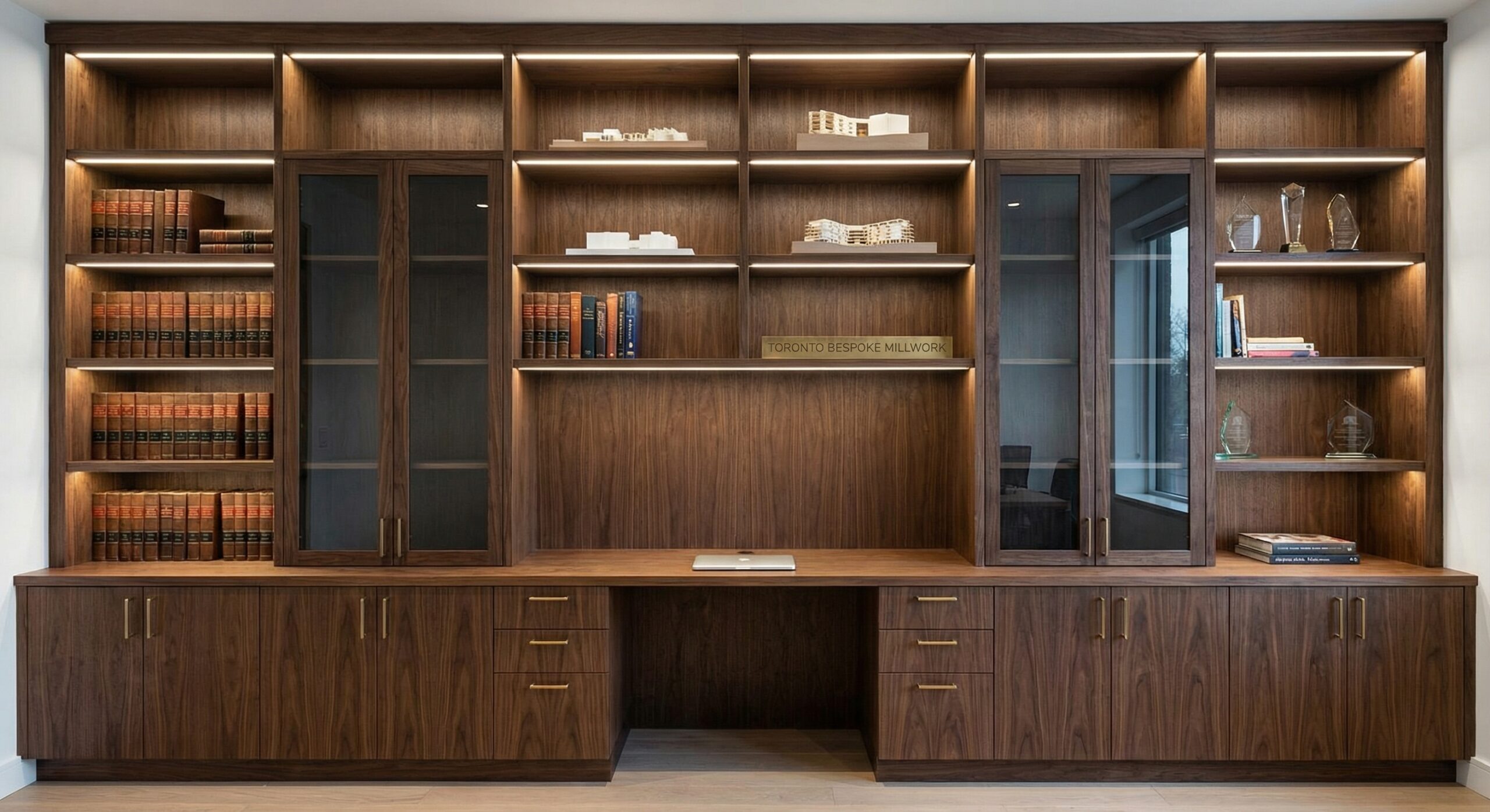 Custom Built-Ins for Toronto Homes and Condos: Smart Storage That Looks Built-In (Because It Is) Custom millwork and bespoke office furniture toronto installed as built-in storage wall with integrated lighting