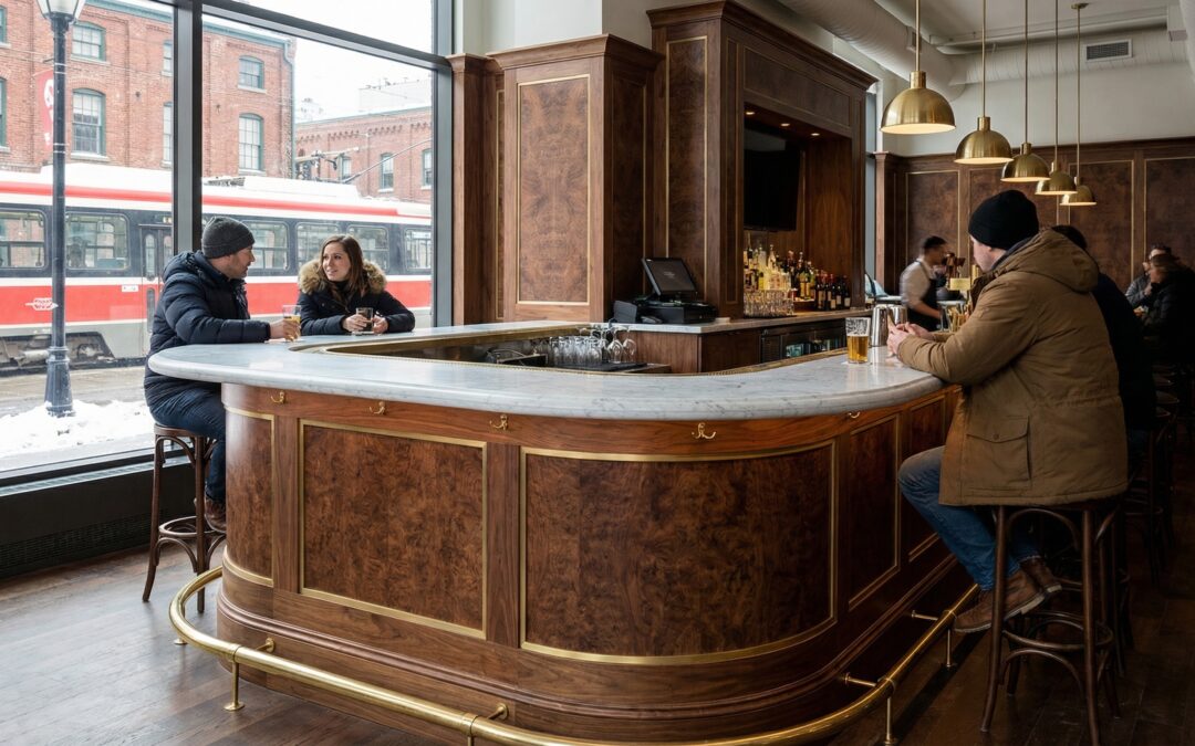pony bar with custom walnut veneer millwork, brass details, and marble bar top in Toronto